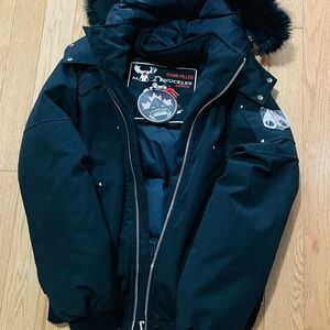 Moose Knuckles Black Jacket with Red and Gray Logo Tag
